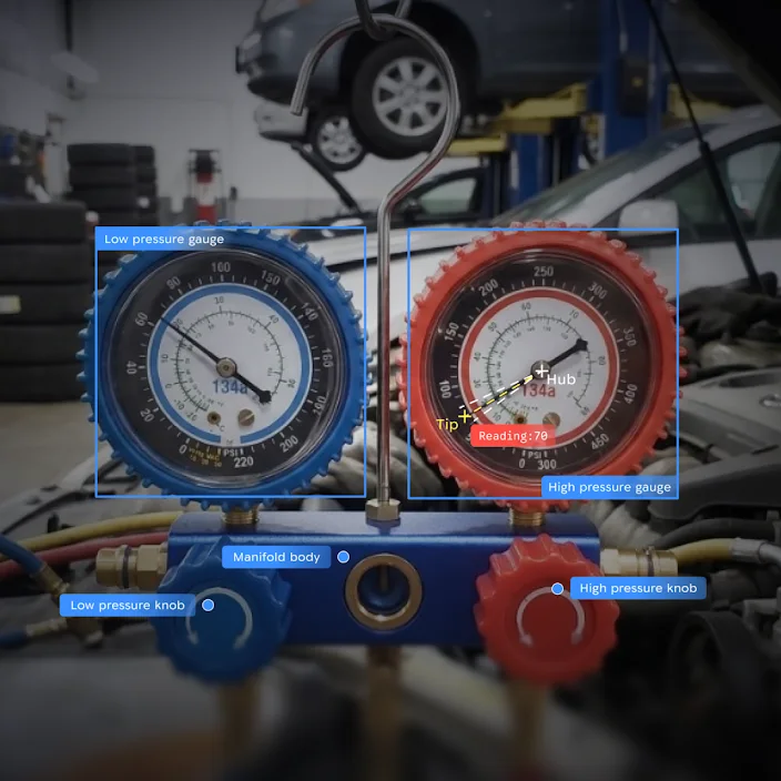 Car maintenance gauges with digital overlays highlighting pressure readings and component parts.